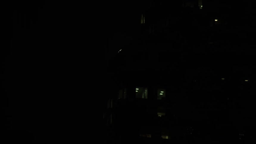 Space station travels in front of the bright full moon
