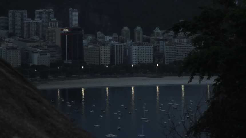 View from across the water of a city at night