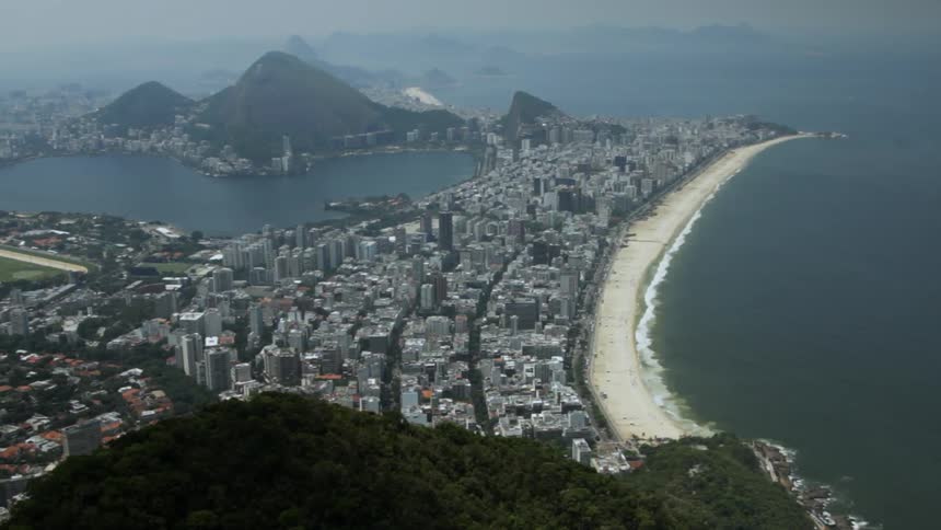 Aerial view of a city located on a strip of land next to the ocean