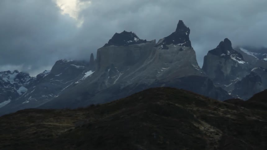 Tall mountain peaks stand in the distance