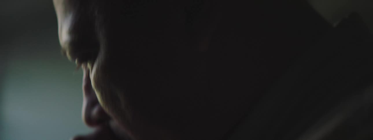 Close up of an elderly man talking to himself and generally looking pained