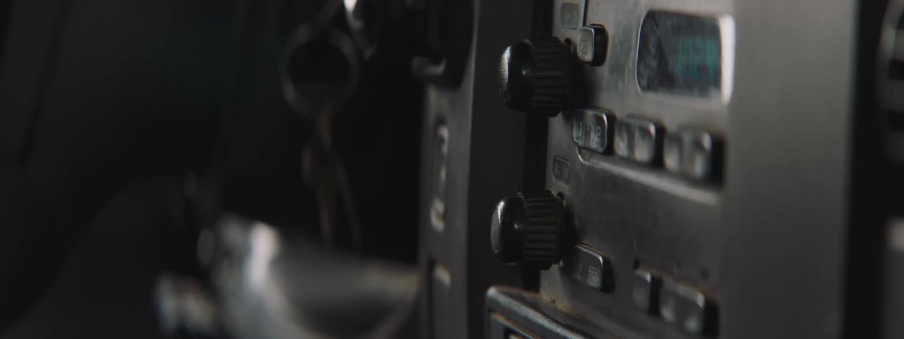 Man turns on the radio in the car