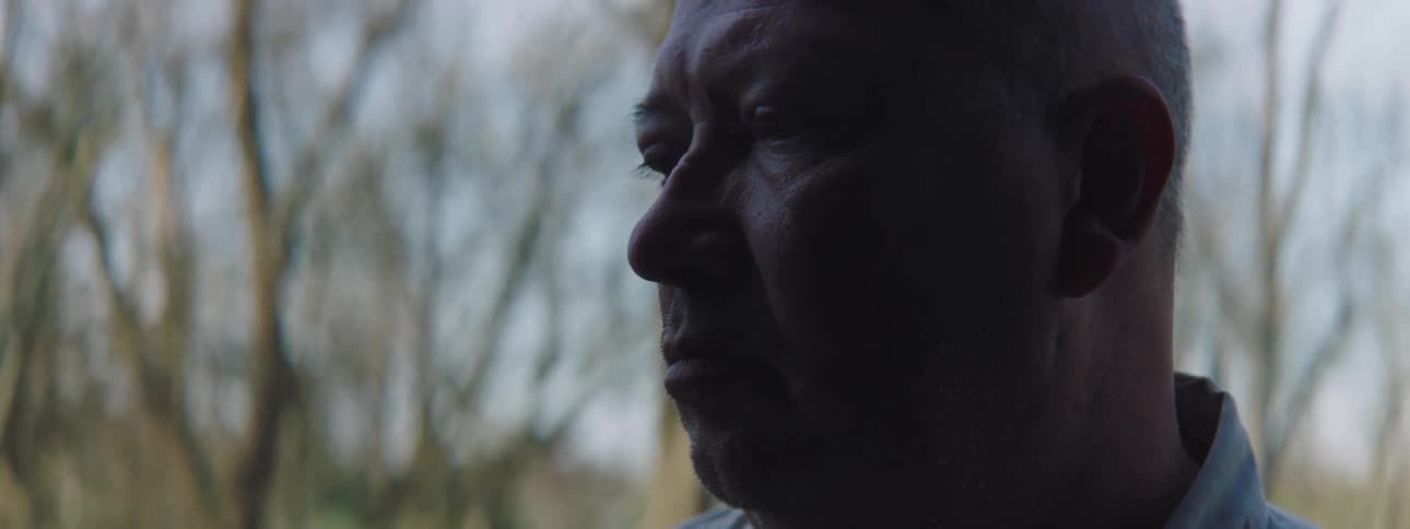 Camera inside a trunk captures an older man opening the trunk looking upset