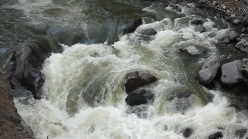 Water is rushing over rocks in this rapid