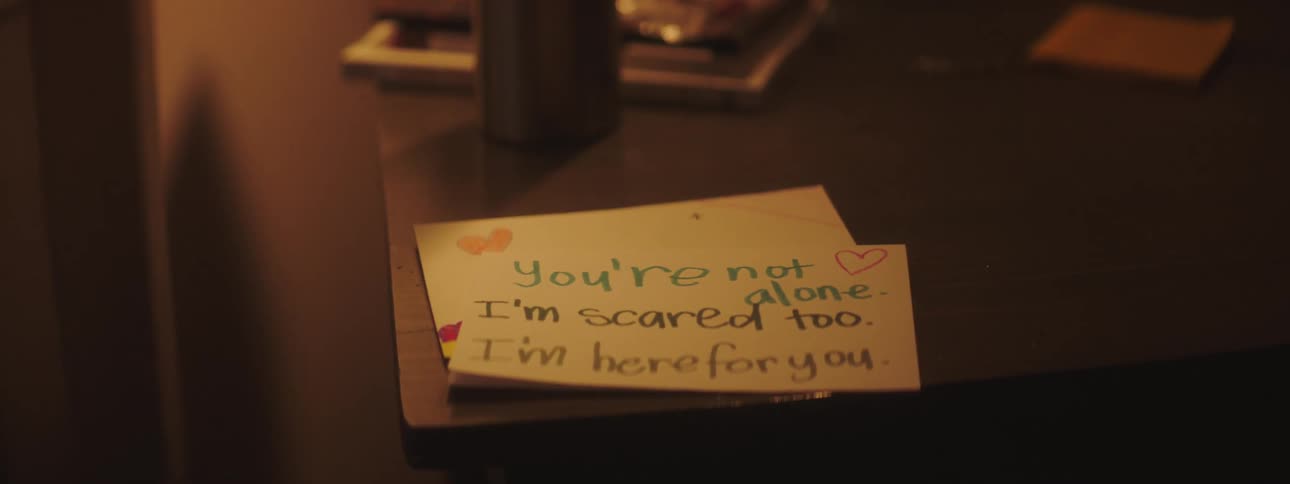 Caring cheering message written on note cards lays on table