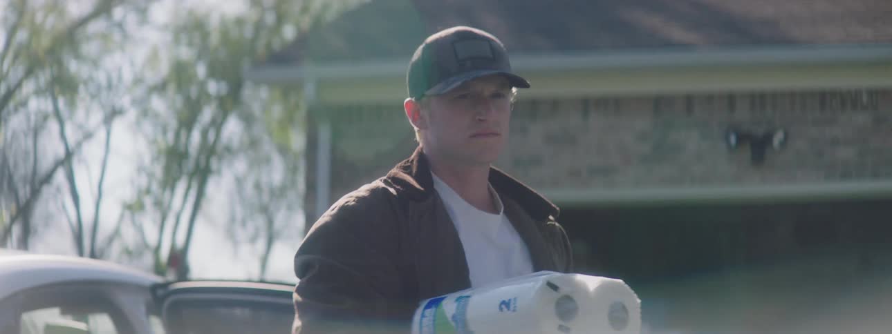 Man takes groceries from car to his house