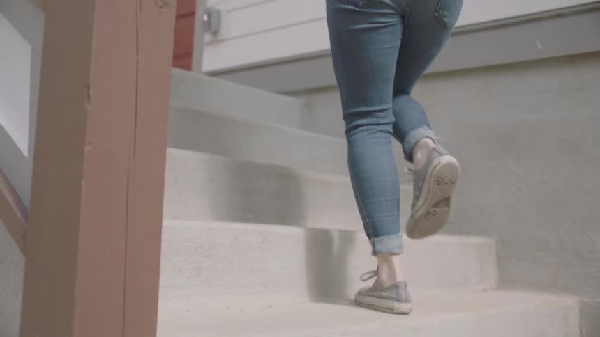 A teenager delivers goods to a house
