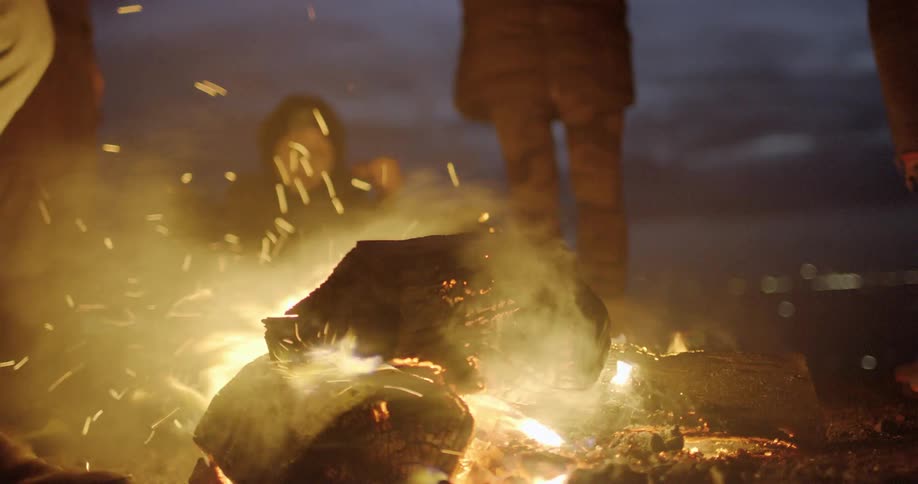 A group of people around a fire pit