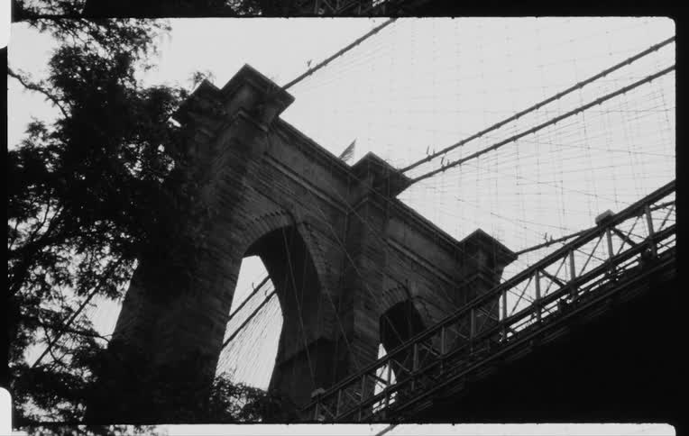 A flag on top of a bridge