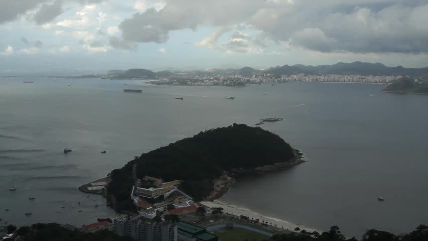 An ocean bay near a city on a cloudy day