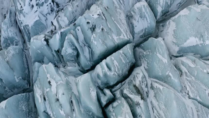A view of a mountian covered in ice is displayed