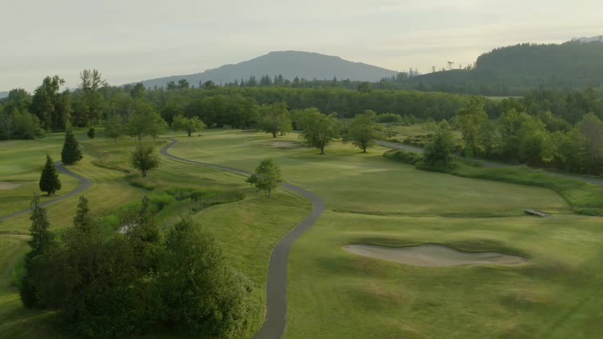 Aerial view of golf course at sunrise