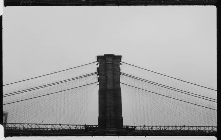 People and traffic travel on a cable stayed suspension bridge