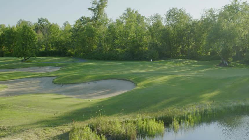The edge of golf course on a sunny day