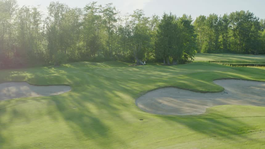 Sand traps lay near each other on golf course