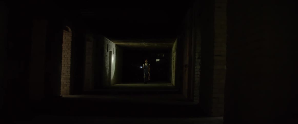 People race down the dark hall