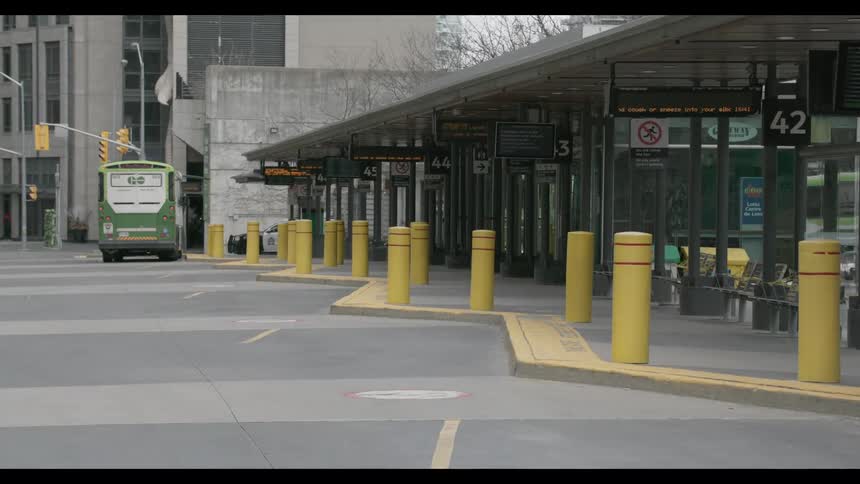 A bus parked outside of a station