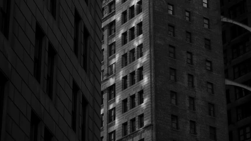 Tall buildings line a city street