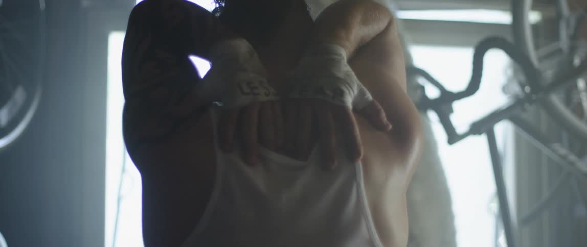 A man stretches his arms over his shoulders