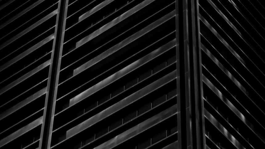 The tall building is covered in darkness
