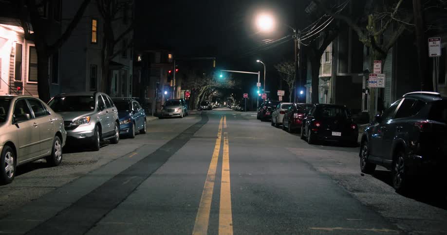 An empty street in the neighborhood at night