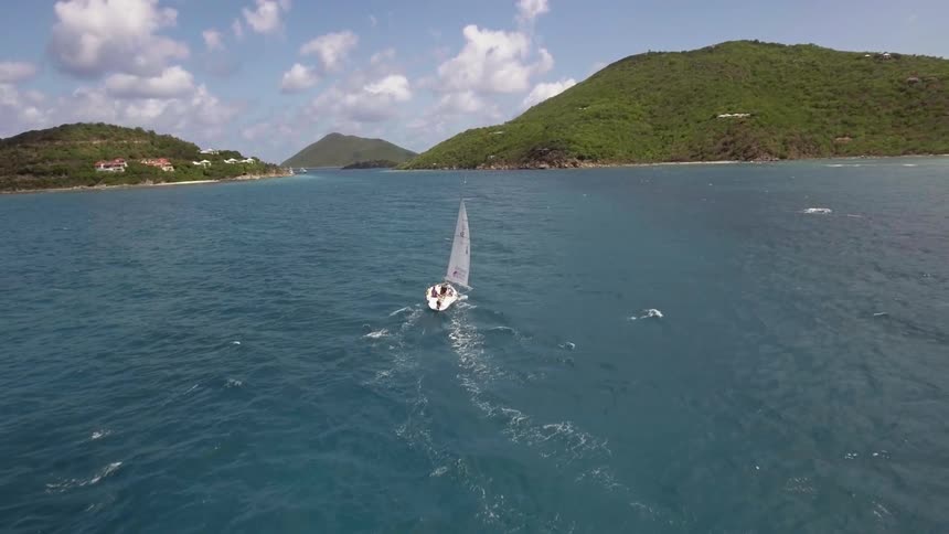People sailing in the water on a sailboat