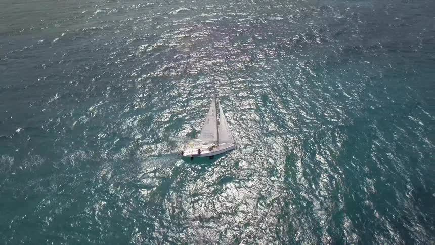 A boat is moving through the ocean water