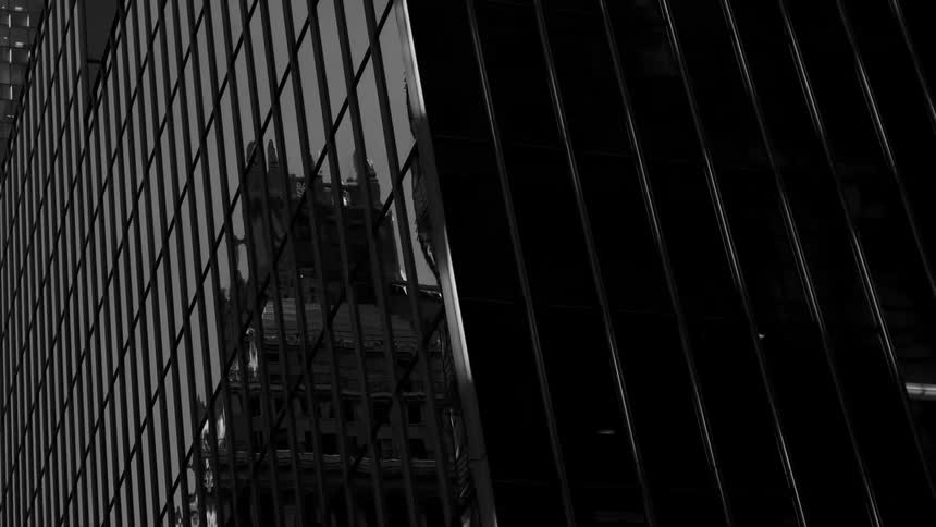 The windows show another building downtown