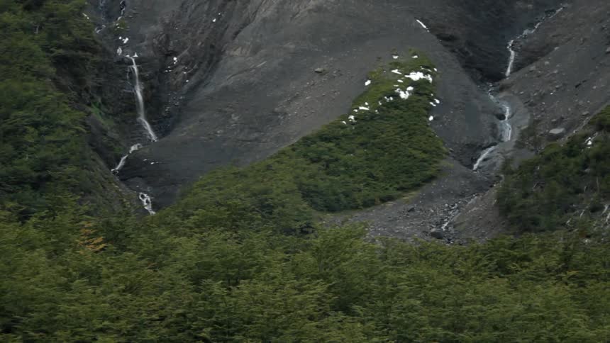 Aerial view of a mountain waterfall and river
