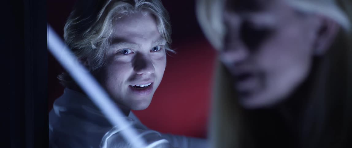 A blond man talks with his blonde mother