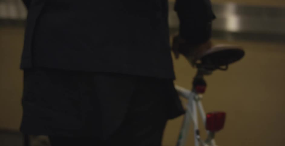 A black man with his bike portrait