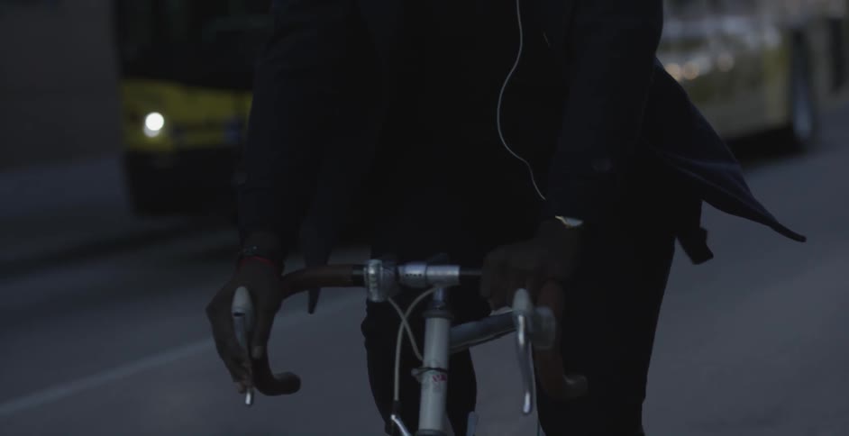A man is riding a bike down the street