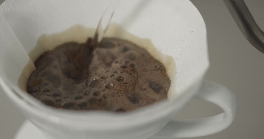 Hot water is poured over a coffee filter and coffee grounds