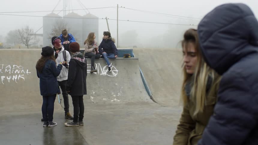 Teenagers talk to one another