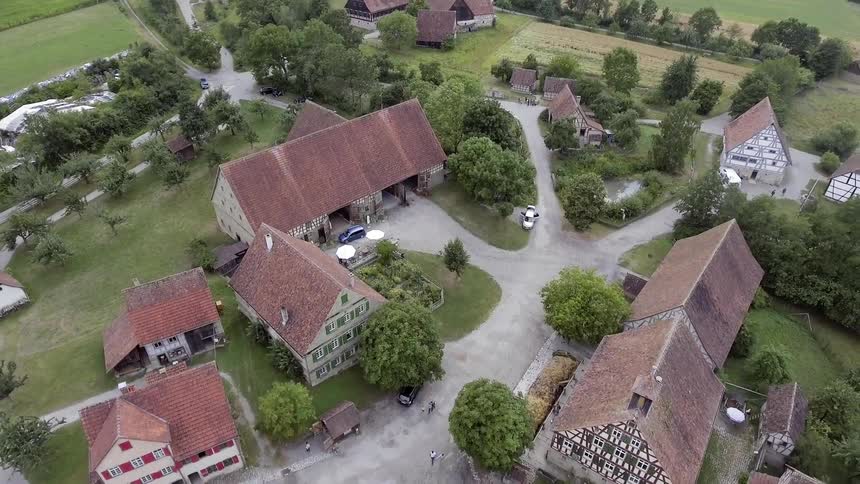 An aerial view of homes in the countryside on a summer day