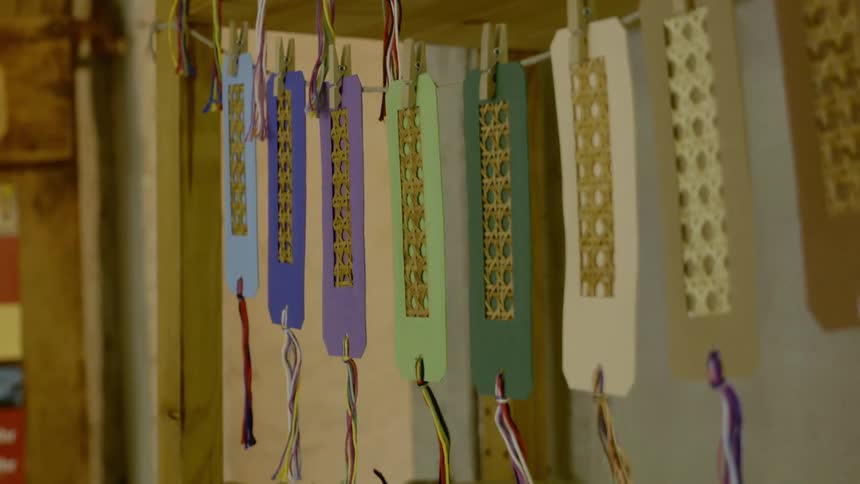 Ornaments are hanging on a line in the room