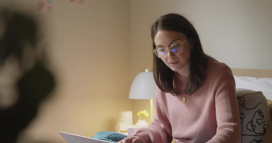 A woman works on her computer