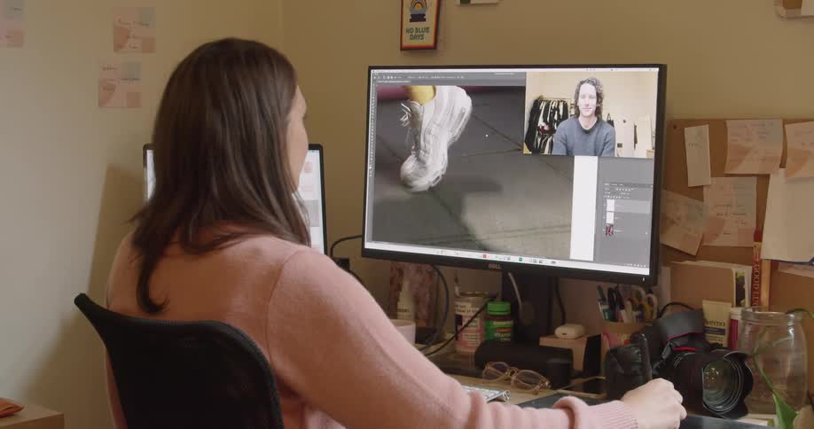Woman uses graphic drawing tablet while video conferencing