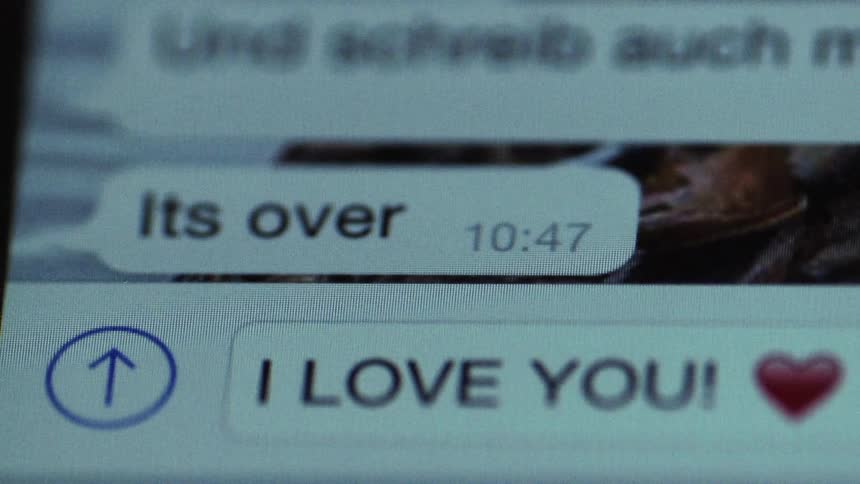 Text message on mobile phone about a break up