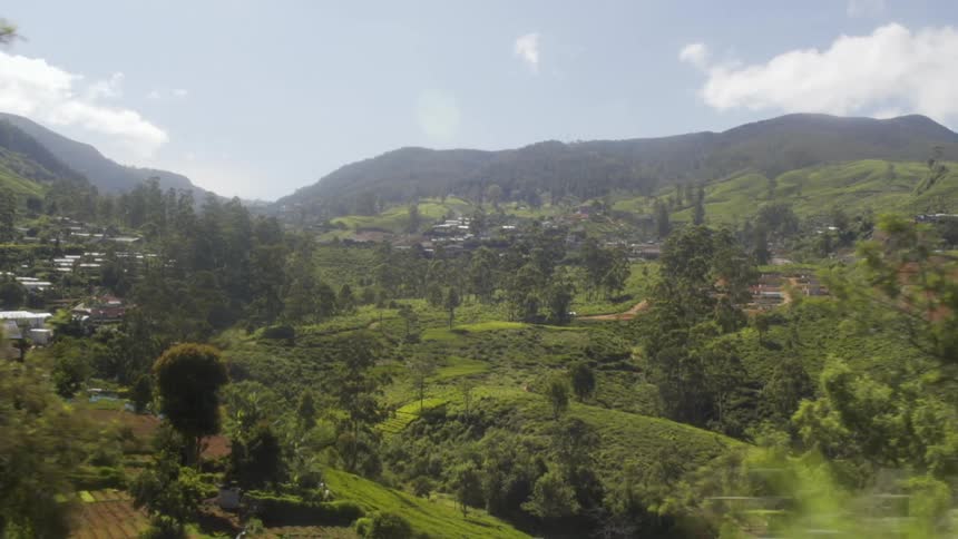 Small community on the hills near mountain at day