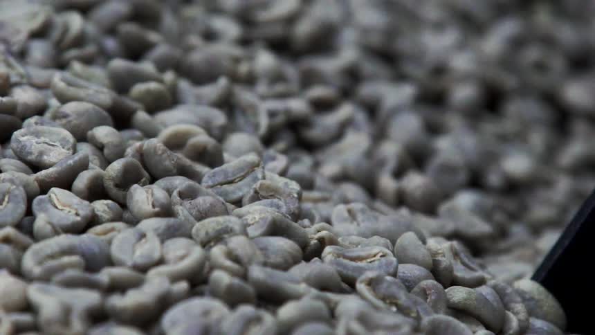 Coffee beans sliding downwards