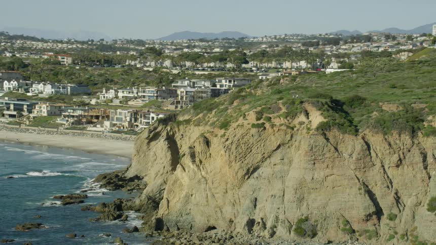 Cliffs loom over a coastal area