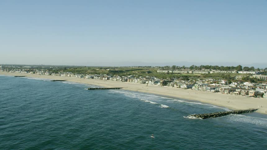 Waves crash against the breakwaters in Southern California