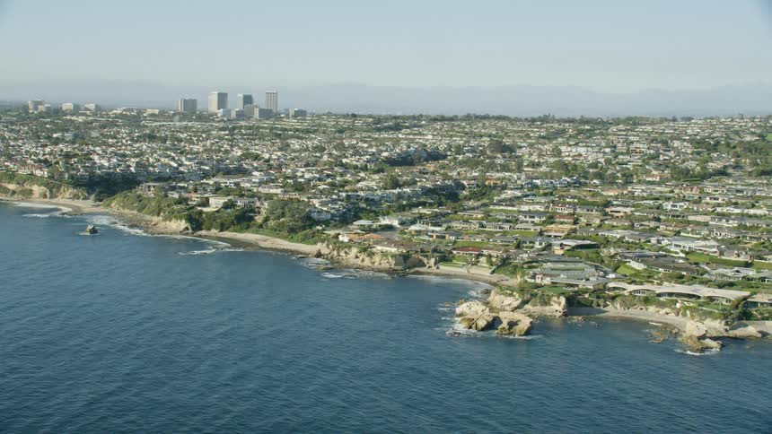 Aerial approach of the Southern California coast in slow motion