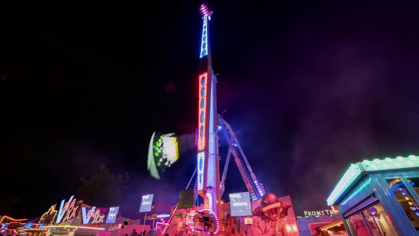 People line up to get on amusement park rides