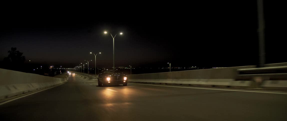 A car driving down a street