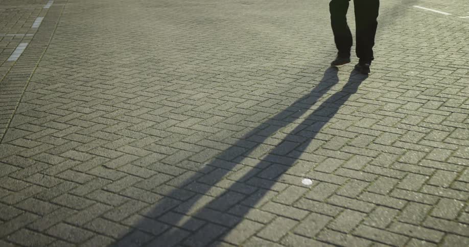 A person is walking on an empty street