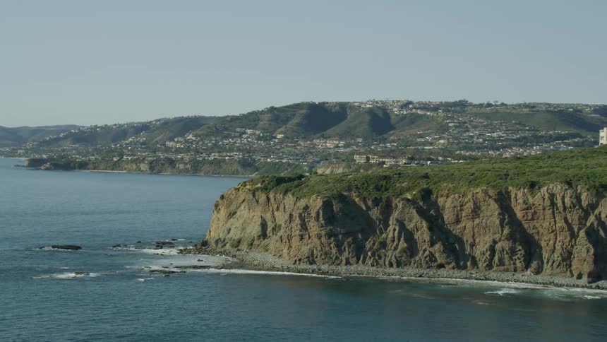 A slow motion aerial approach of Dana Point in Orange County California