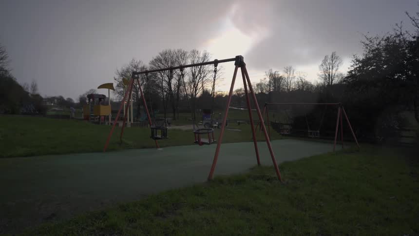 An empty playground on a cloudy day