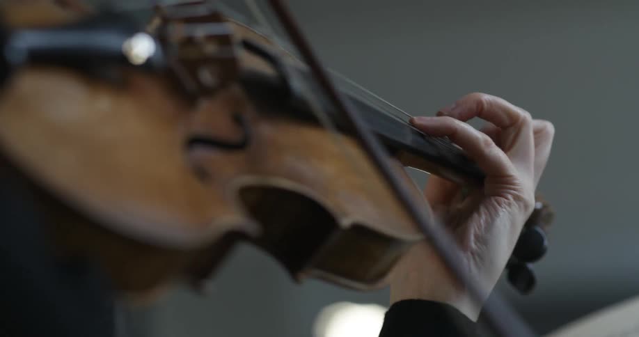 A person is playing a violin